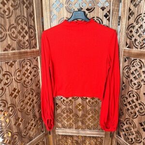 Red long sleeve crop top with cuffed sleeves
